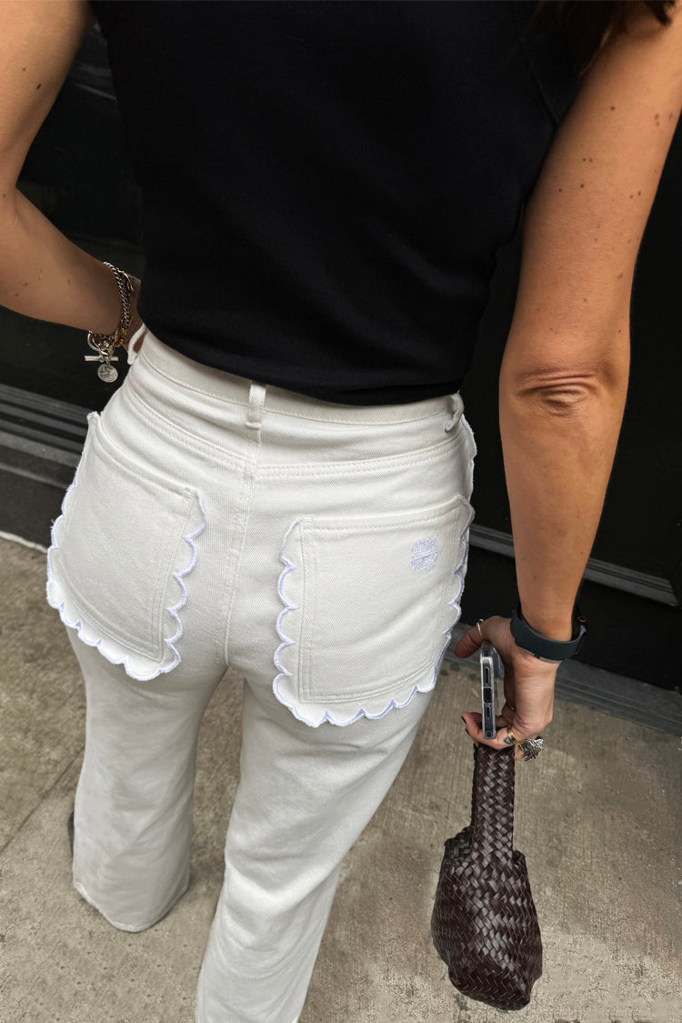 caption_Model wears Ecru Scallop Detail Jeans in UK size 10/ US 6