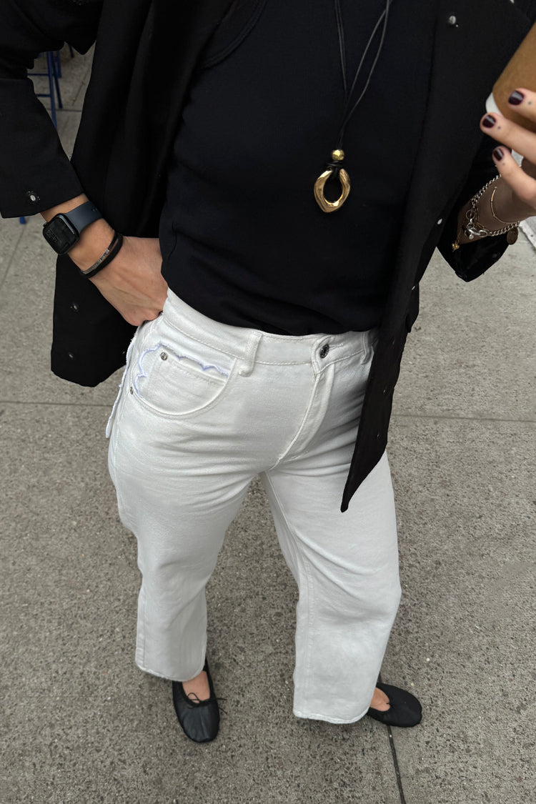 caption_Model wears Ecru Scallop Detail Jeans in UK size 10/ US 6