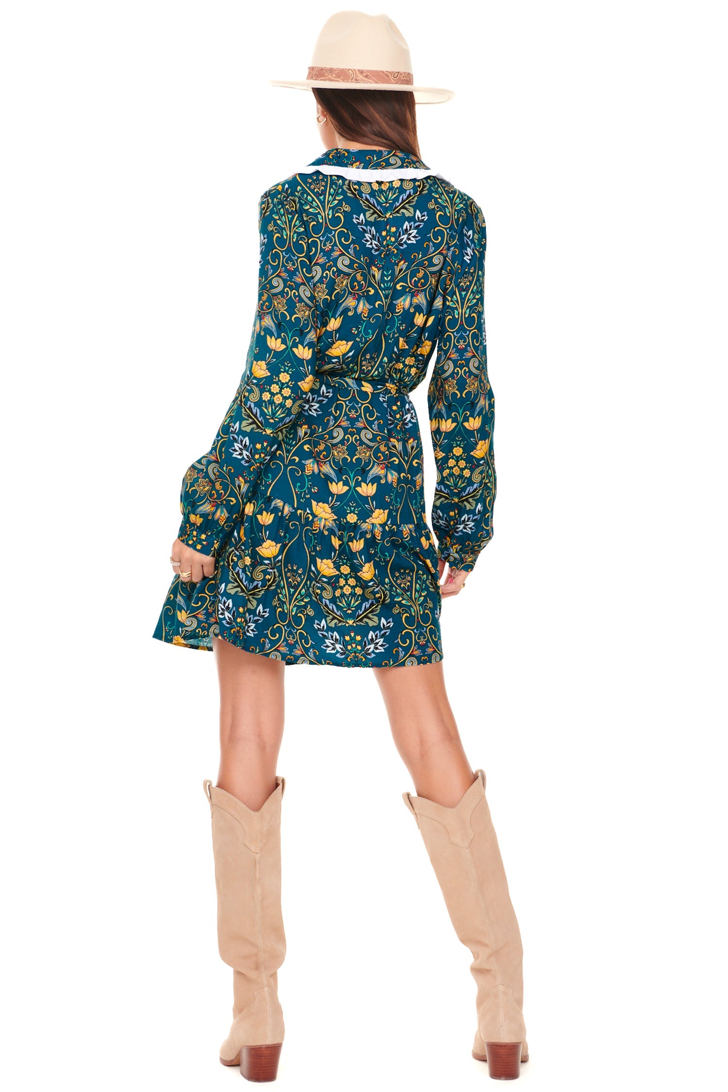 Model wearing Evelyn Mini Dress standing facing away from the camera