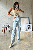 Thumbnail for caption_Model wears Gold Ribbed Tank Top in UK size 10/ US 6