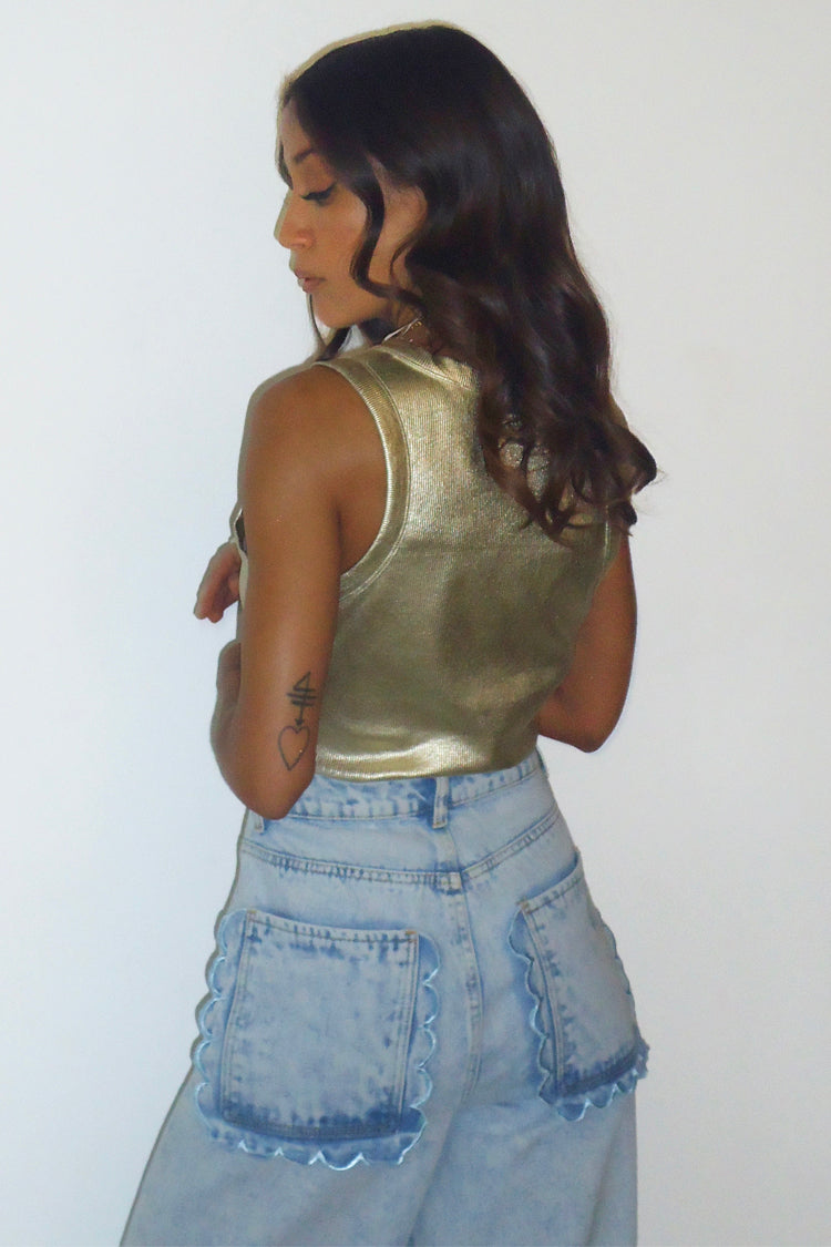 caption_Model wears Gold Ribbed Tank Top in UK size 10/ US 6