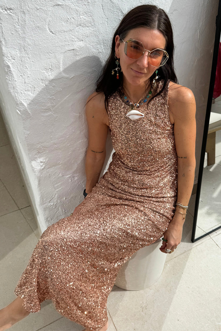 caption_Model wears Gold Sequin Dorris Skirt  in UK size 10/ US 6
