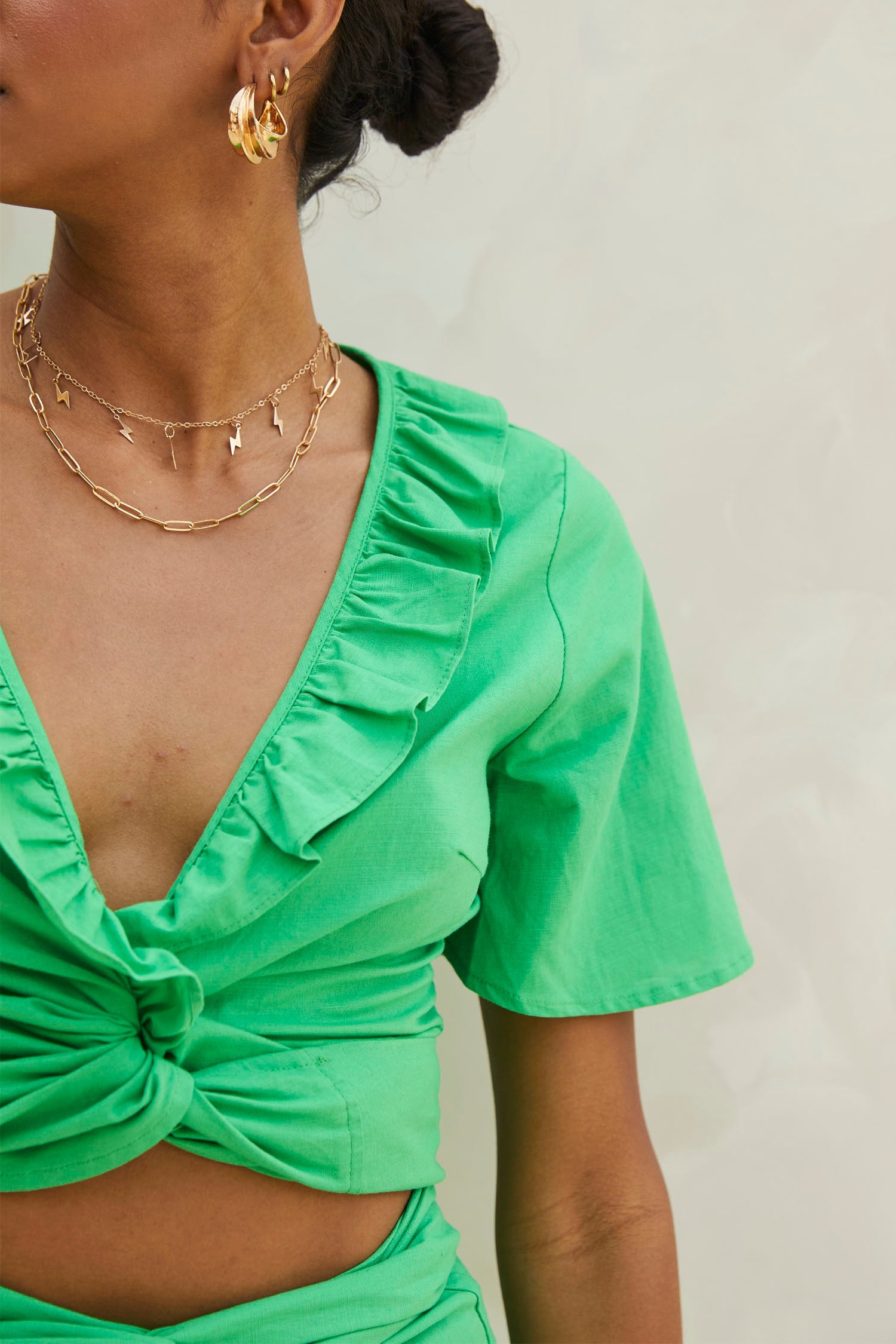 Model wearing Green Cotton Linen Roma Top standing facing the camera close up