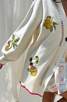 Thumbnail for caption_Model wears Cream Ibiza Martha Cardigan in UK size 10/ US 6