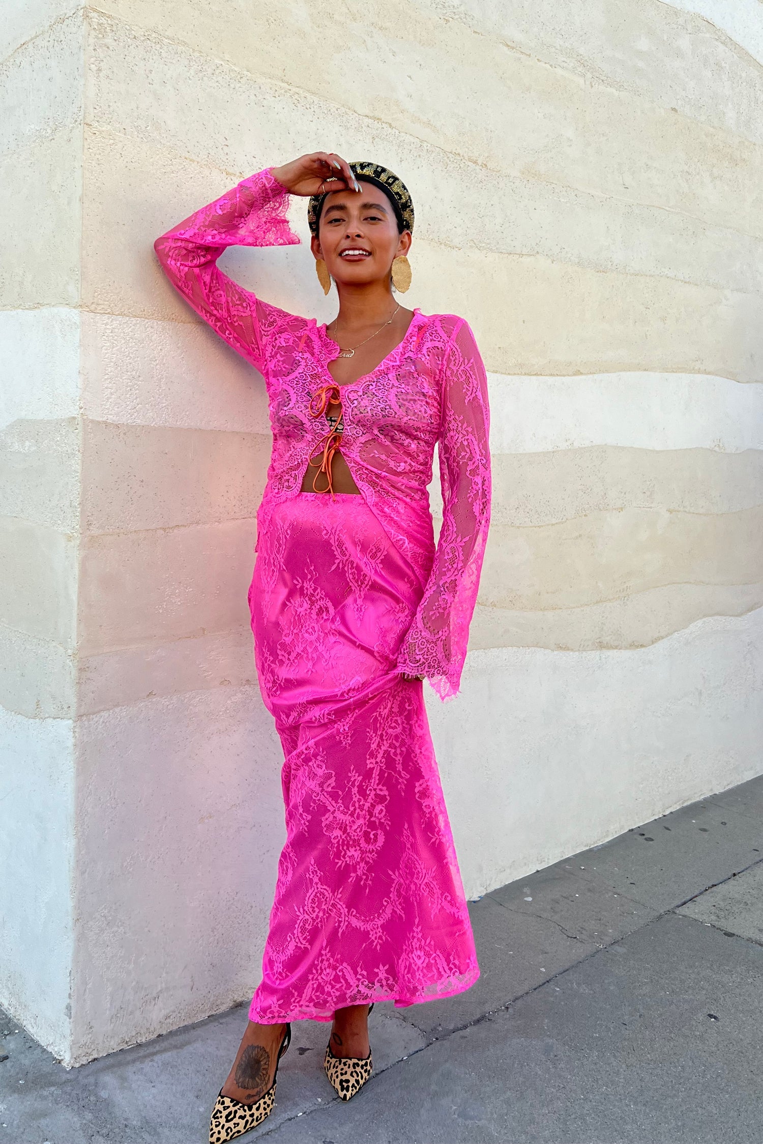 Model wearing Pink Lace Skirt standing facing the camera