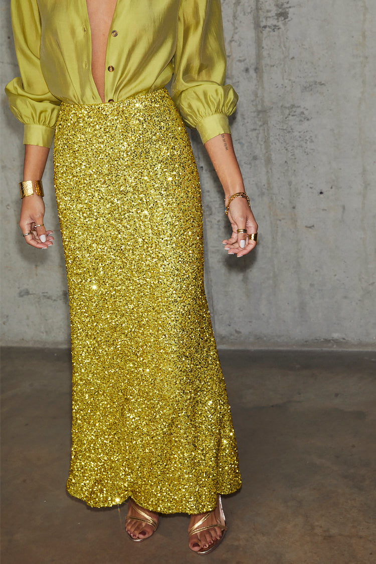 caption_Model wears Lime Sequin Dorris Skirt in UK size 10/ US 6