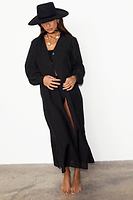 Thumbnail for caption_Model wears Black Longlined Running Wilder Miley Shirt in UK size 10/ US 6