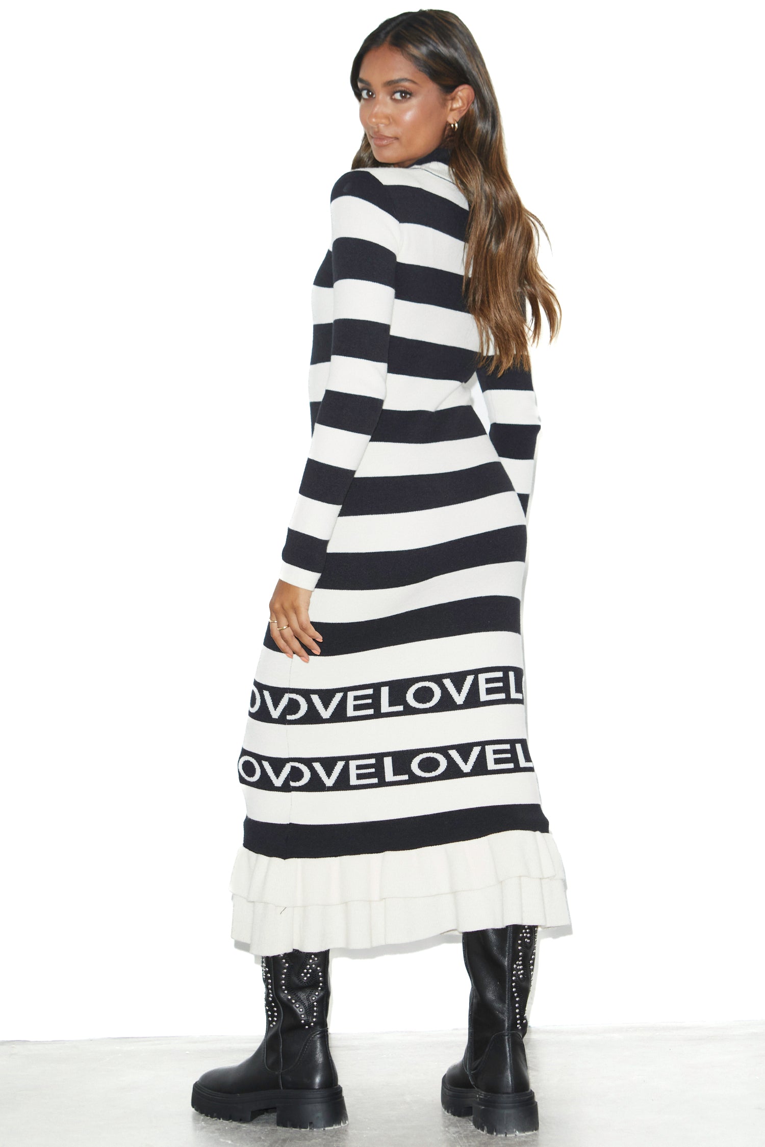 Model wearing Love Ruffle Midi Dress standing facing the camera side ways