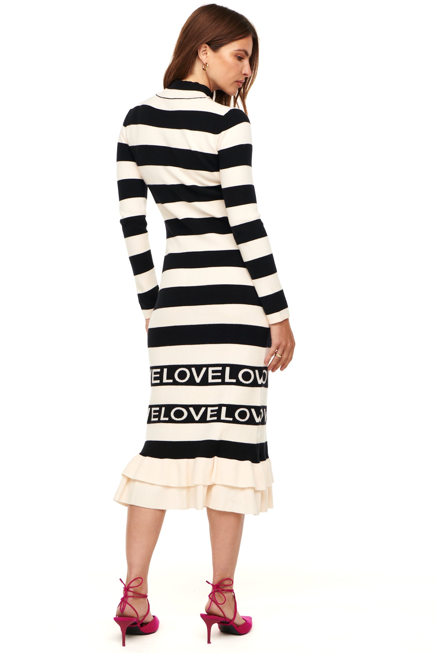 Model wearing Love Ruffle Midi Dress standing facing away from the camera 