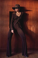 Thumbnail for Model wearing Bronze Sparkle Trousers standing facing the camera