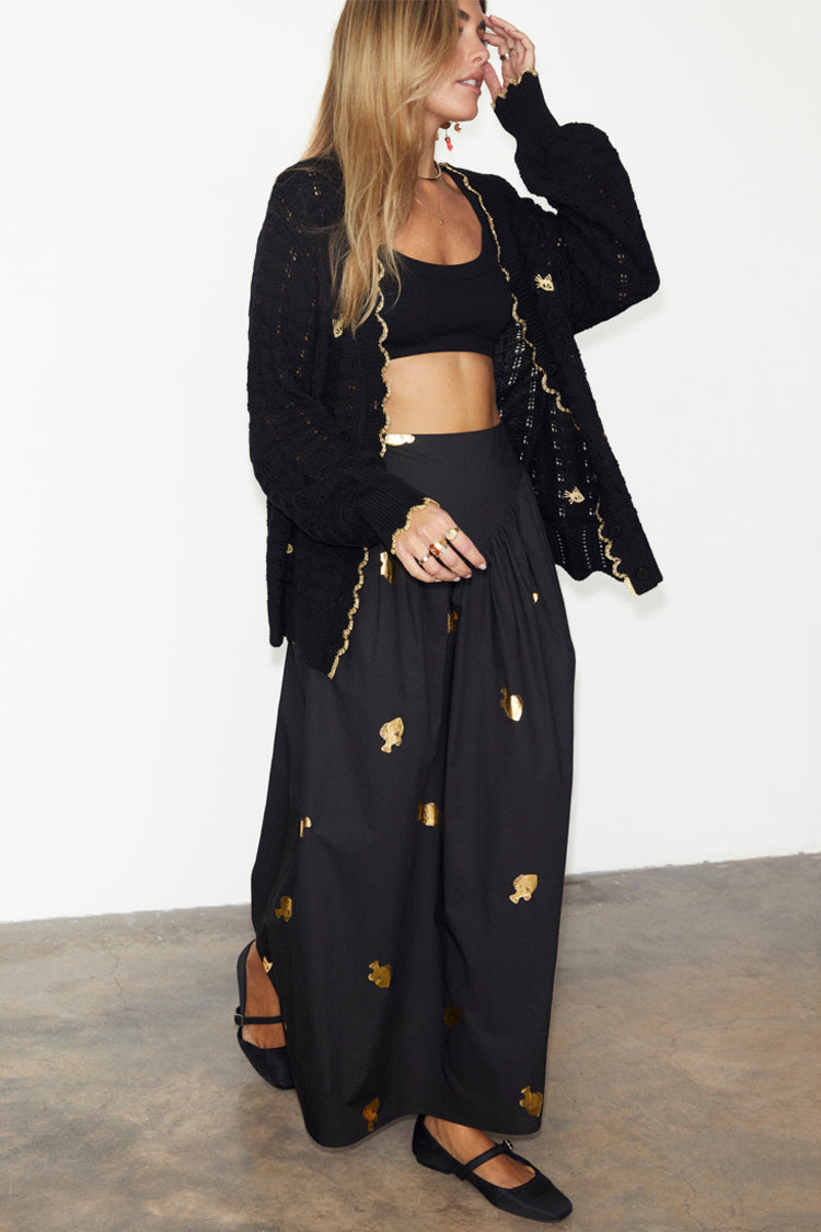 caption_Model wears Black Pointelle Knit Cardigan With Gold Fish in UK size 10/ US 6
