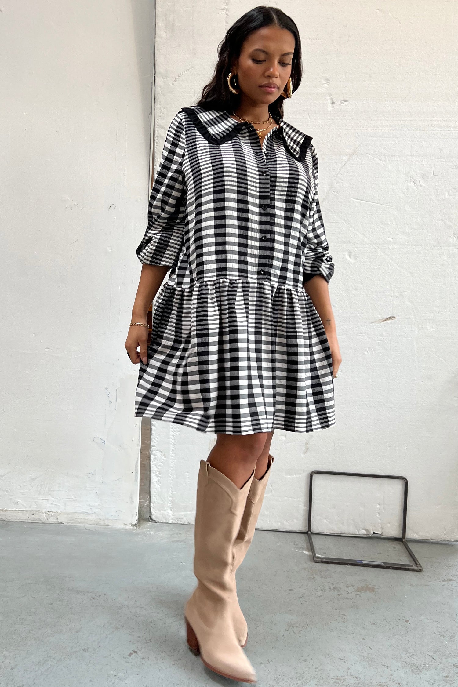  Model wearing Check Mini Molly Dress standing facing the camera