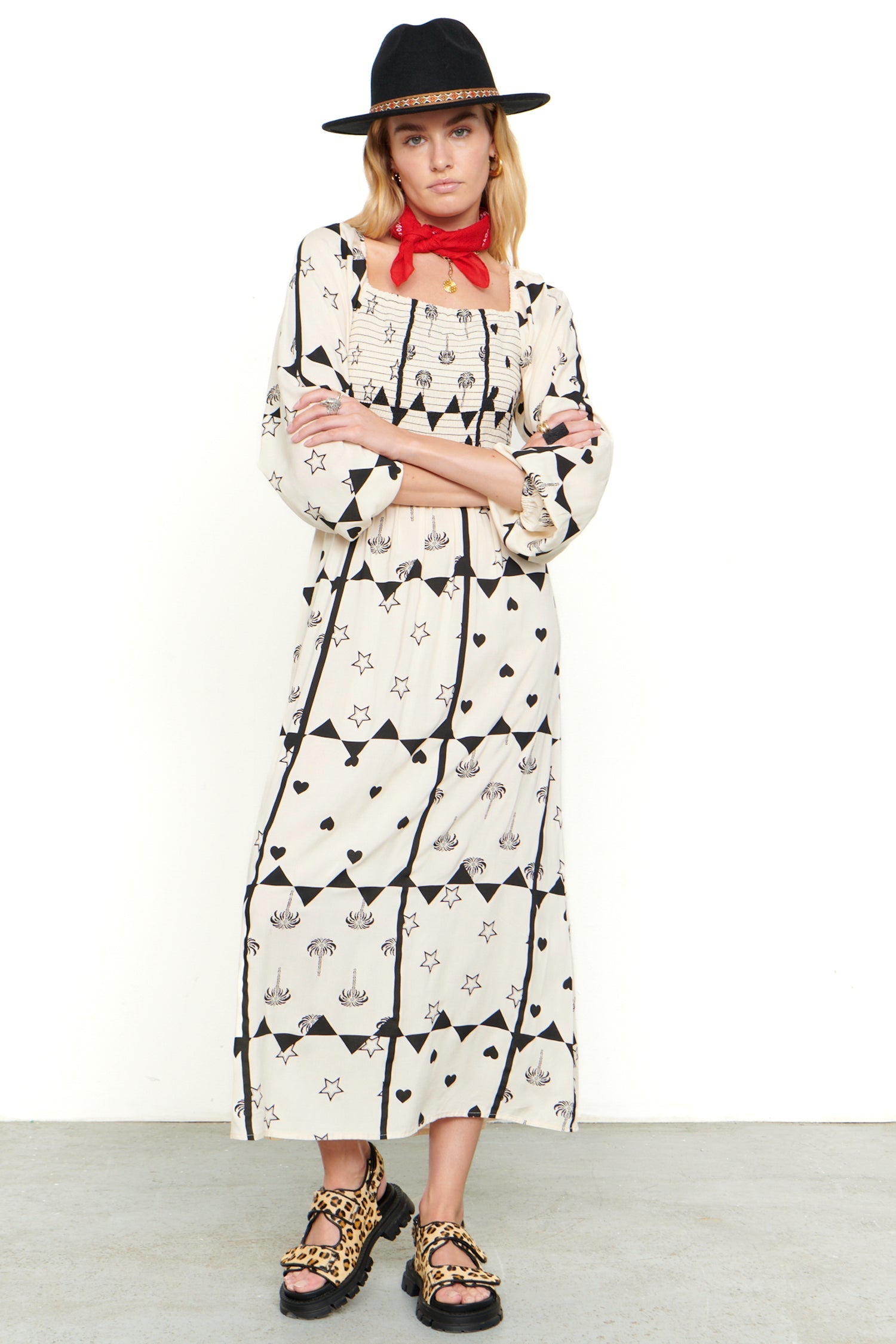Model wearing Mono Palm Jasmine Dress standing facing the camera 