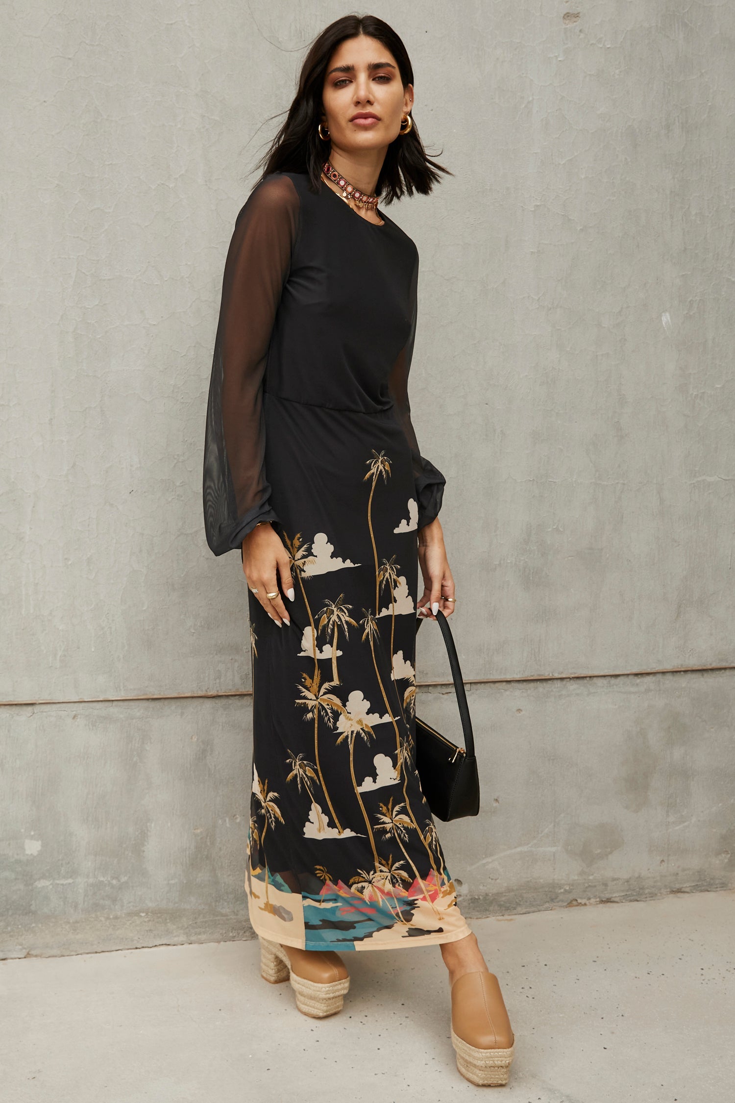 Model wearing Midnight Oasis Dress standing facing the camera