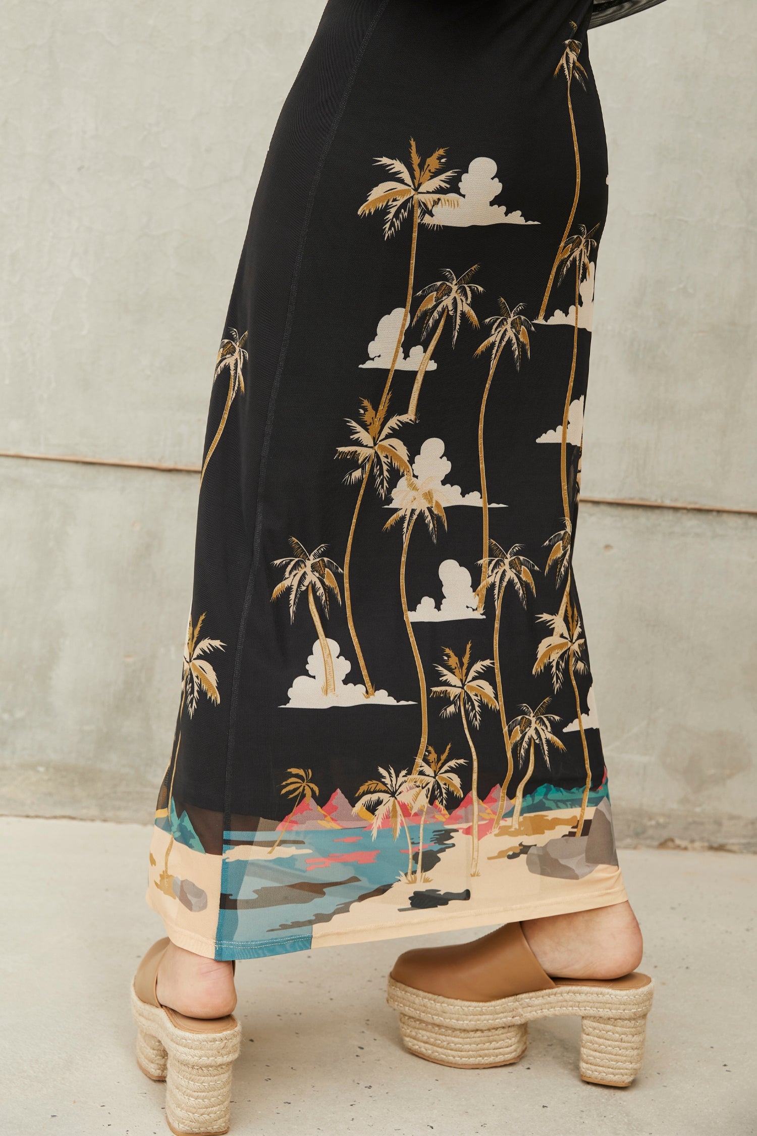 Model wearing Midnight Oasis Dress close up hem 