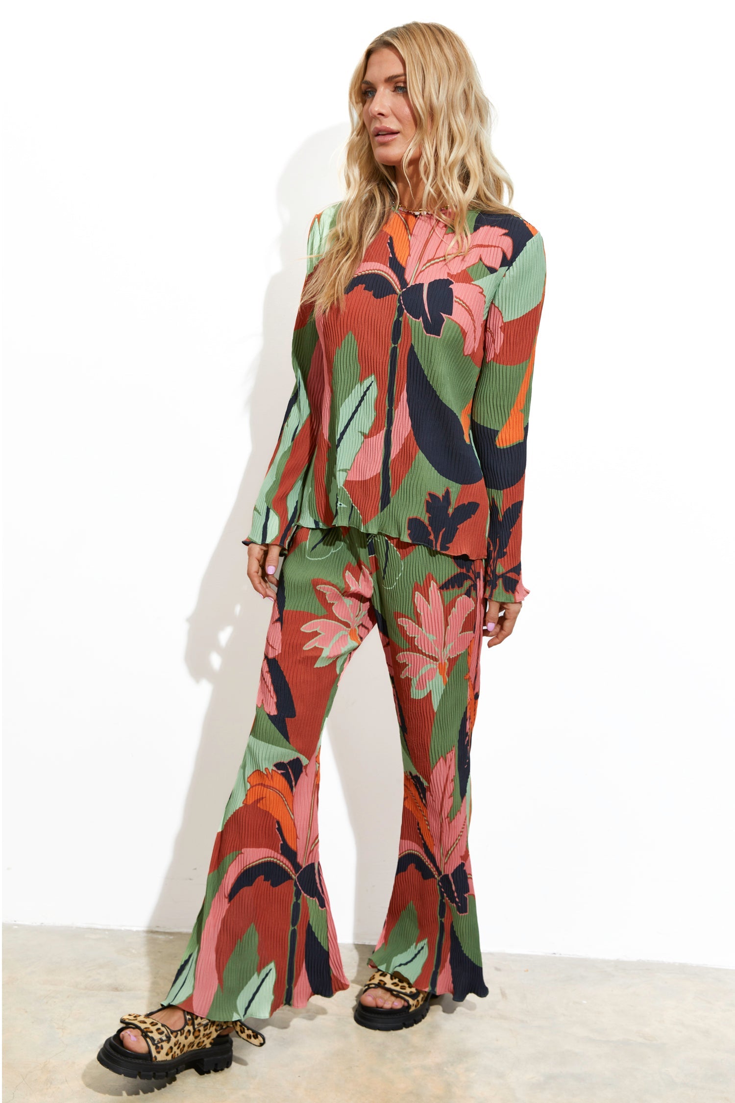 Model wearing Winter Palm Plisse Trouser standing facing the camera