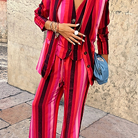 Thumbnail for caption_Model wears Pink Stripe Elisa Trousers in UK size 8/ US 4