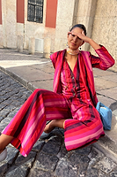 Thumbnail for caption_Model wears Pink Stripe Elisa Trousers in UK size 8/ US 4