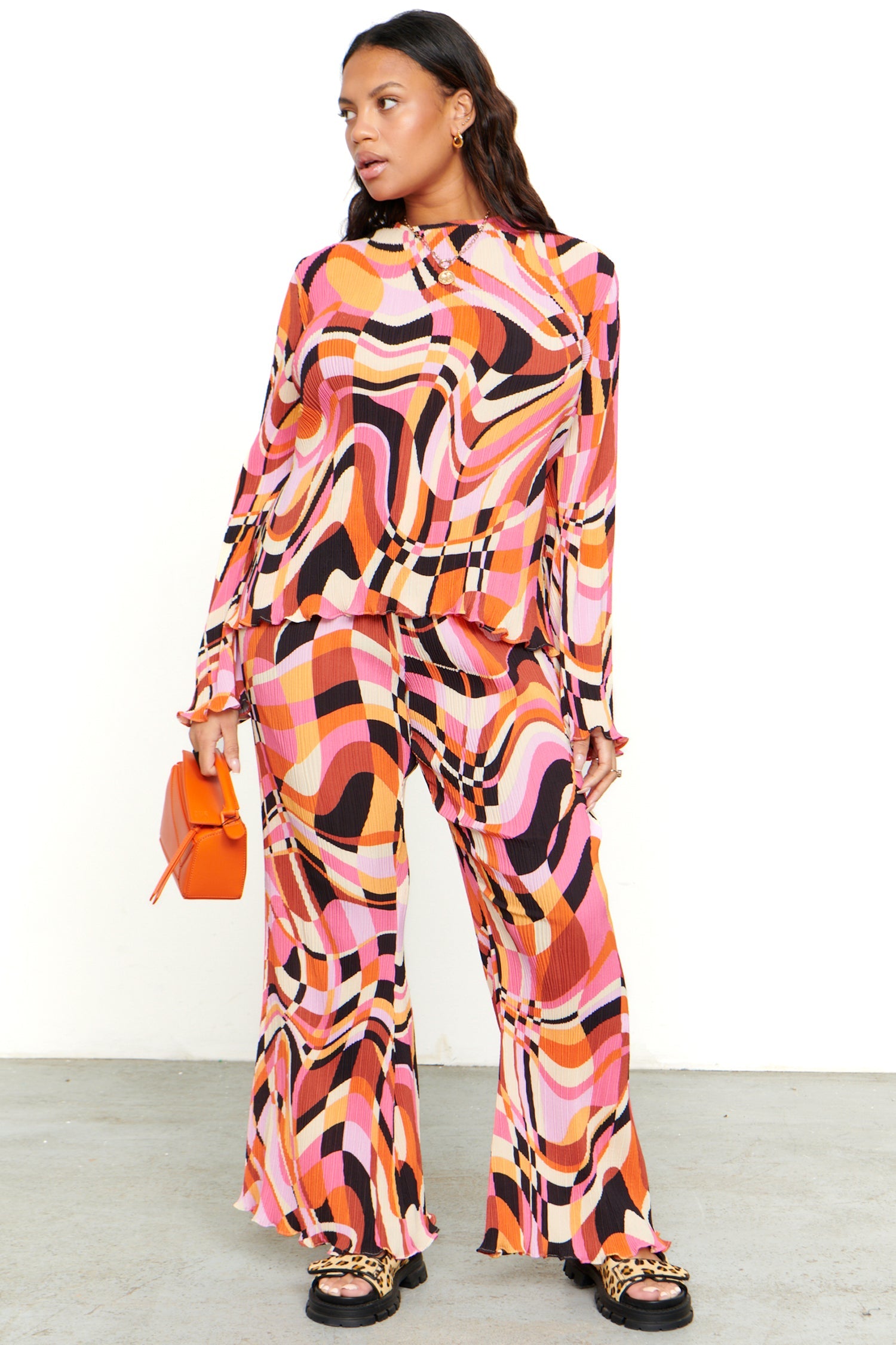 Model wearing Retro Plisse Trouser standing facing the camera 