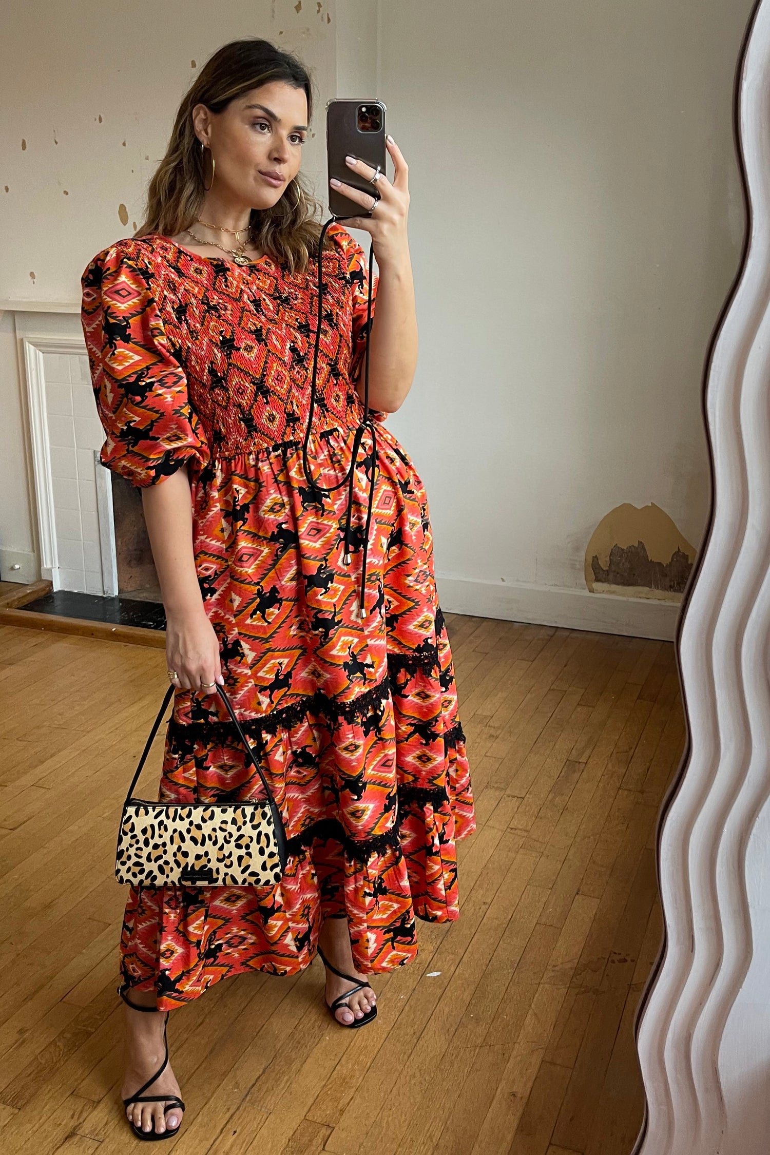 Model wearing Red Rodeo Midi Dress standing facing the camera