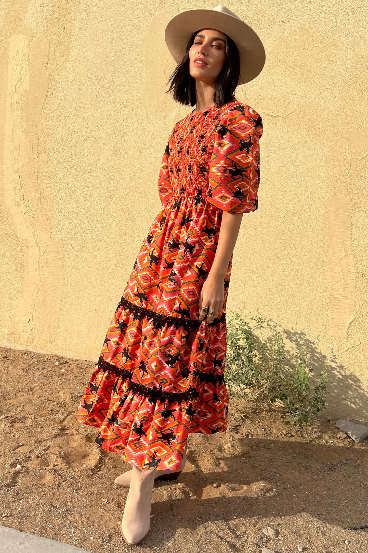 Model wearing Red Rodeo Midi Dress standing facing the camera