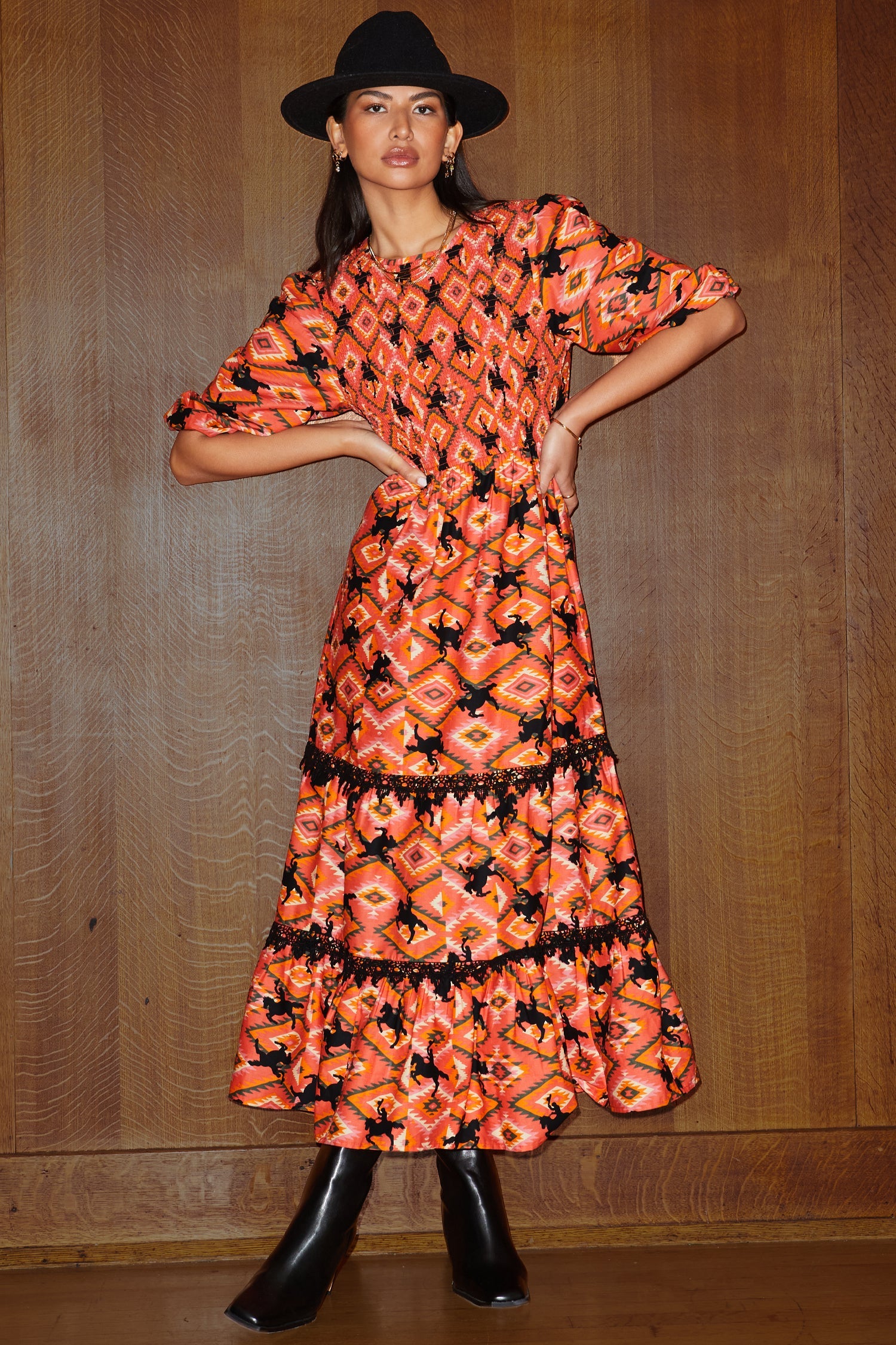 Model wearing Red Rodeo Midi Dress standing facing the camera