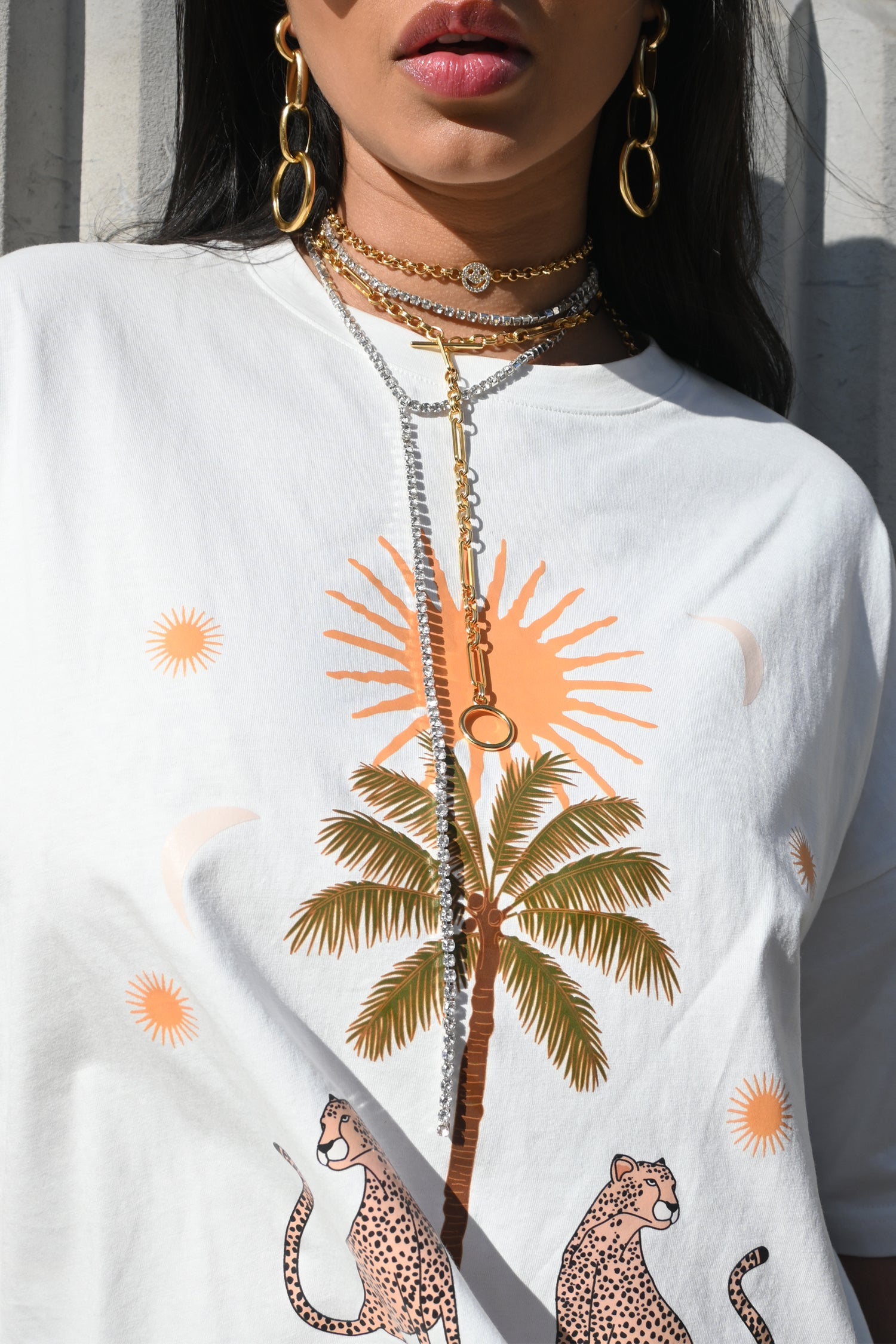 Model wearing White Running Wild T-Shirt standing facing the camera