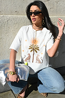 Thumbnail for Model wearing White Running Wild T-Shirt standing facing the camera