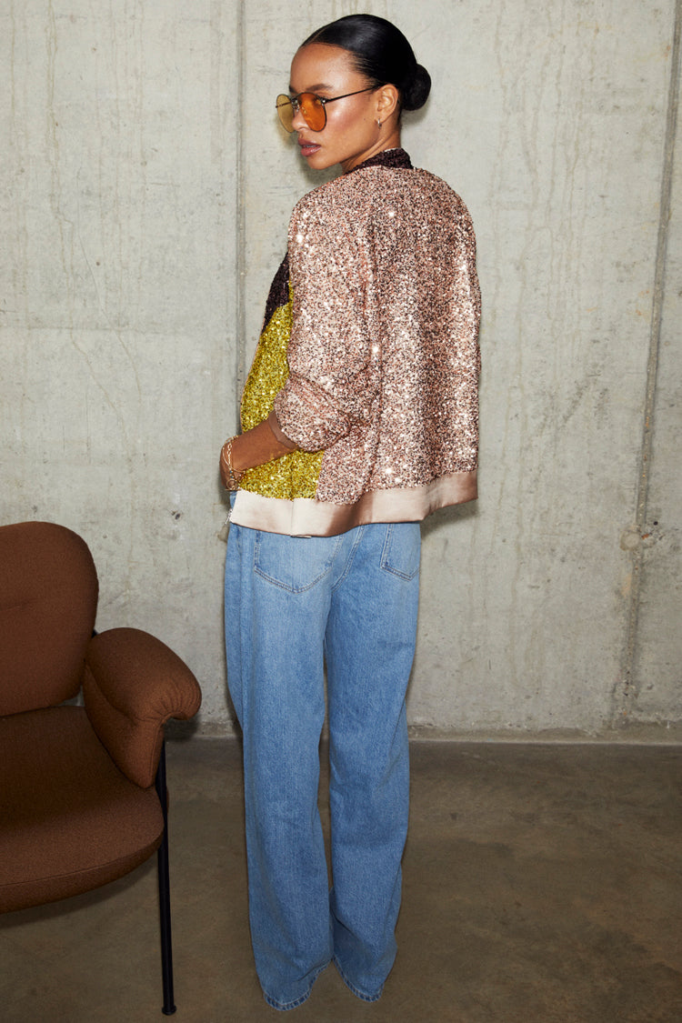 caption_Model wears Sequin Mix Bomber in UK size 10/ US 6