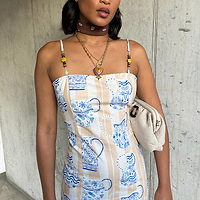 Thumbnail for  caption_Model wears Sicilian Bandeau Dress in UK size 10/ US 6