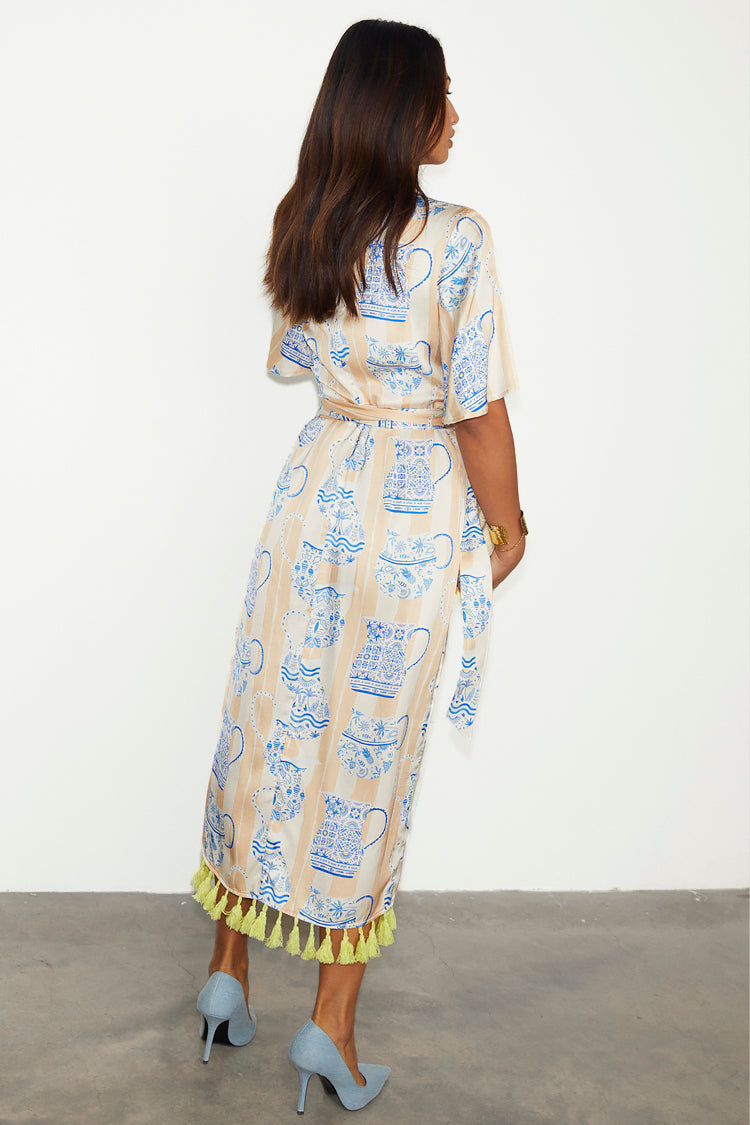  caption_Model wears Sicilian Ceryes Wrap Dress in UK size 10/ US 6