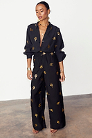 Thumbnail for caption_Model wears Black Gold Snake Elissa Trousers in UK size 10/ US 6