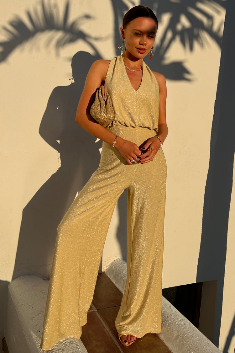 Model wearing Gold Sparkle Jumpsuit
