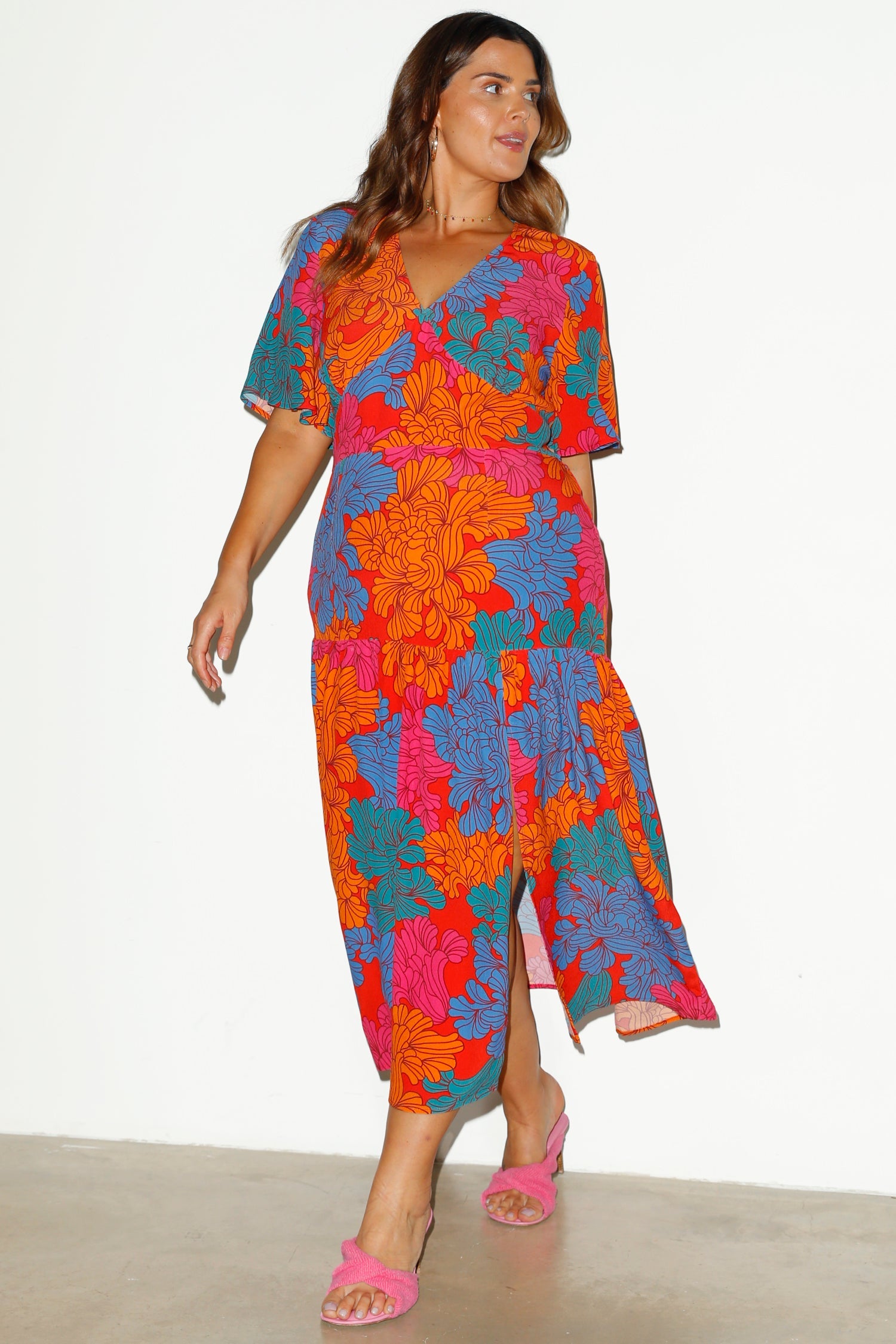 Model wearing Tabitha Floral Claver Dress facing towards the camera 