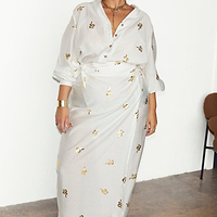 Thumbnail for caption_Model wears  Gold Snake Jaspre Wrap Skirt in UK size 18 / US 14