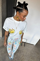 Thumbnail for caption_Model wears Lemon Boob T-shirt in UK size 10/ US 6