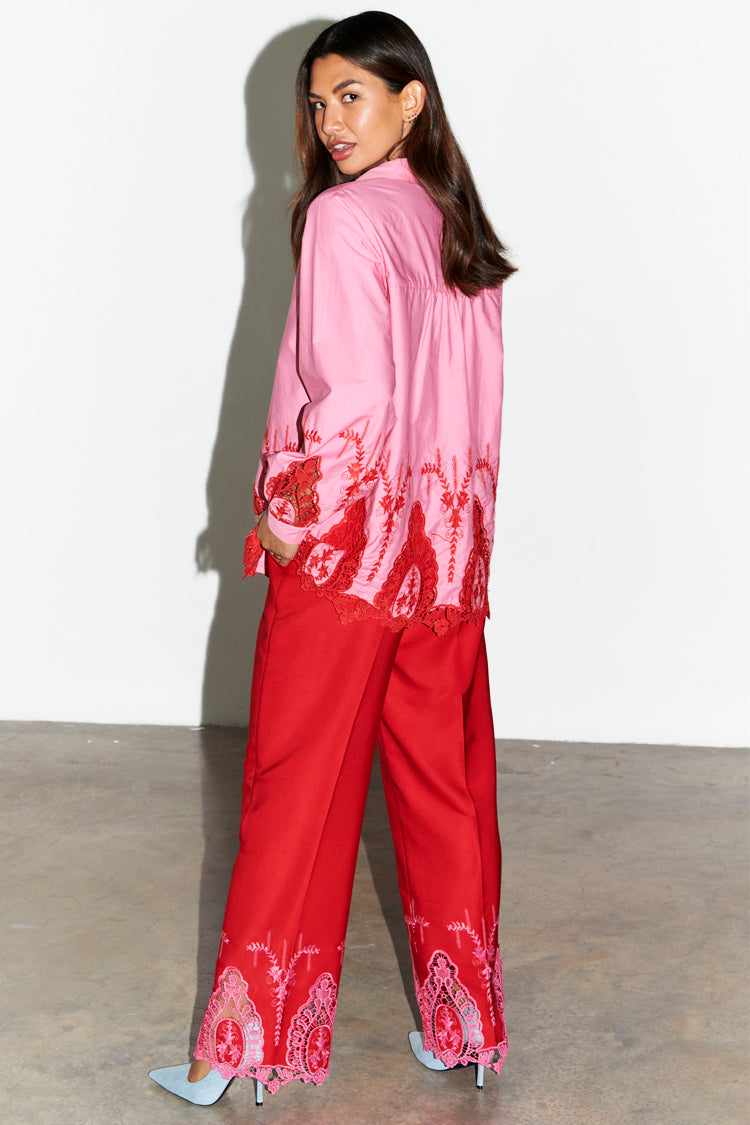 caption_Model wears Red And Pink Arden Trouser in UK size 10/ US 6