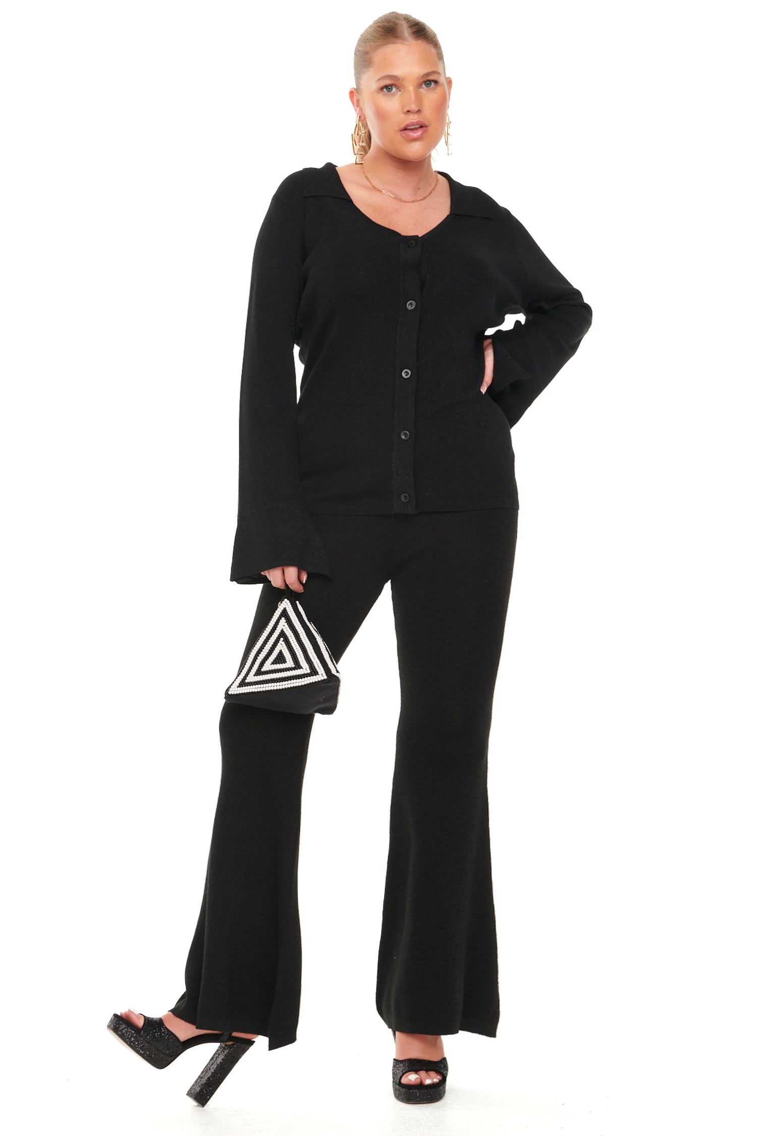 Model wearing Black Lurex Trousers standing facing the camera