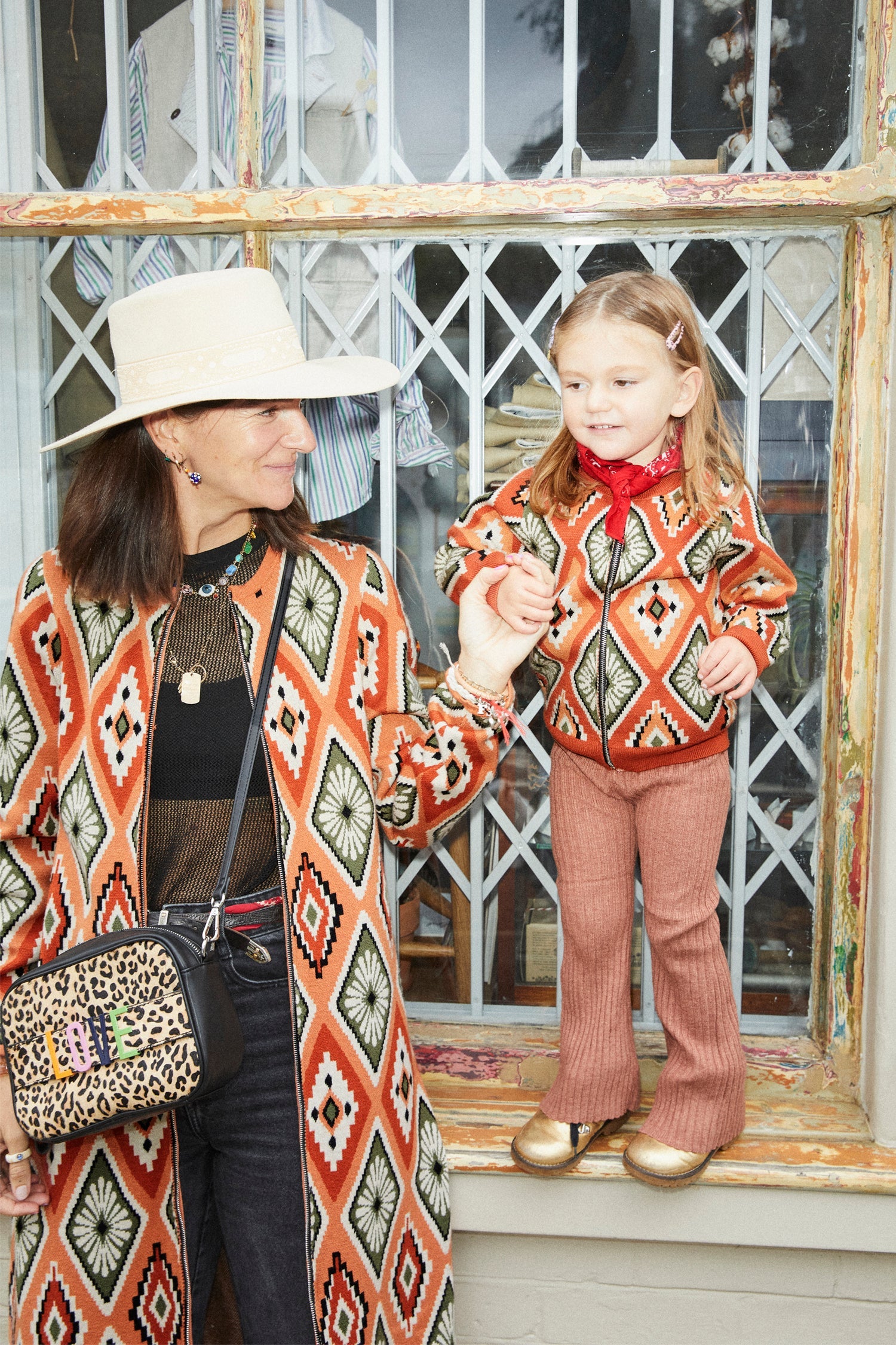 Model wearing NFD Kids Diamond Bomber standing facing the camera 