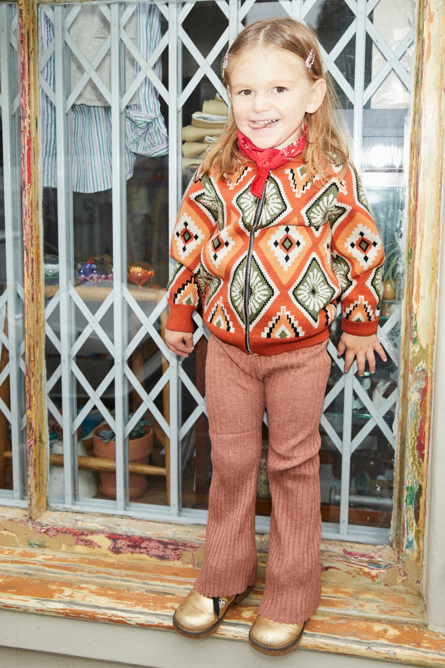 Model wearing NFD Kids Diamond Bomber standing facing the camera 
