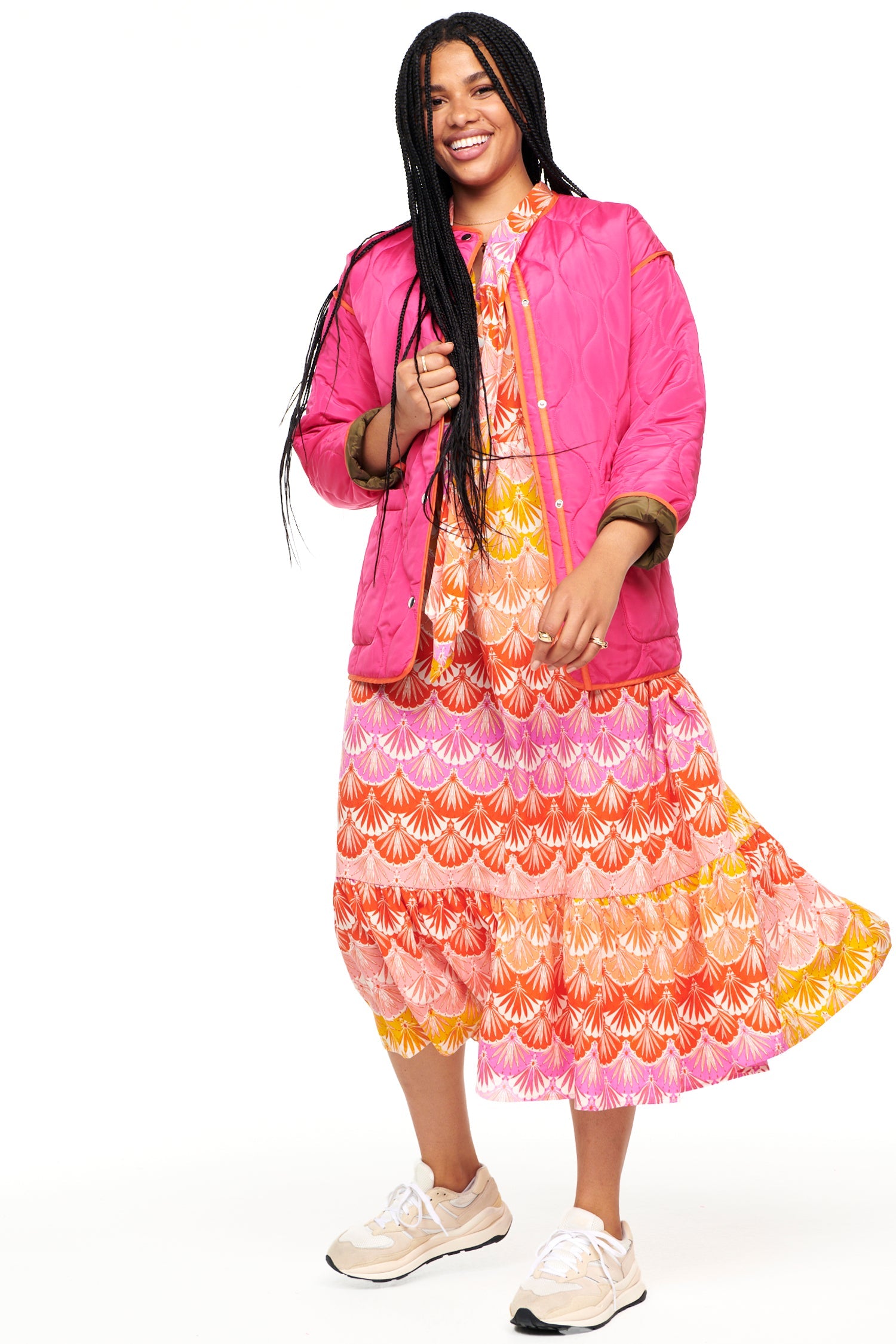 Model wearing Pink And Khaki Reversible Quilted Jacket standing facing the camera