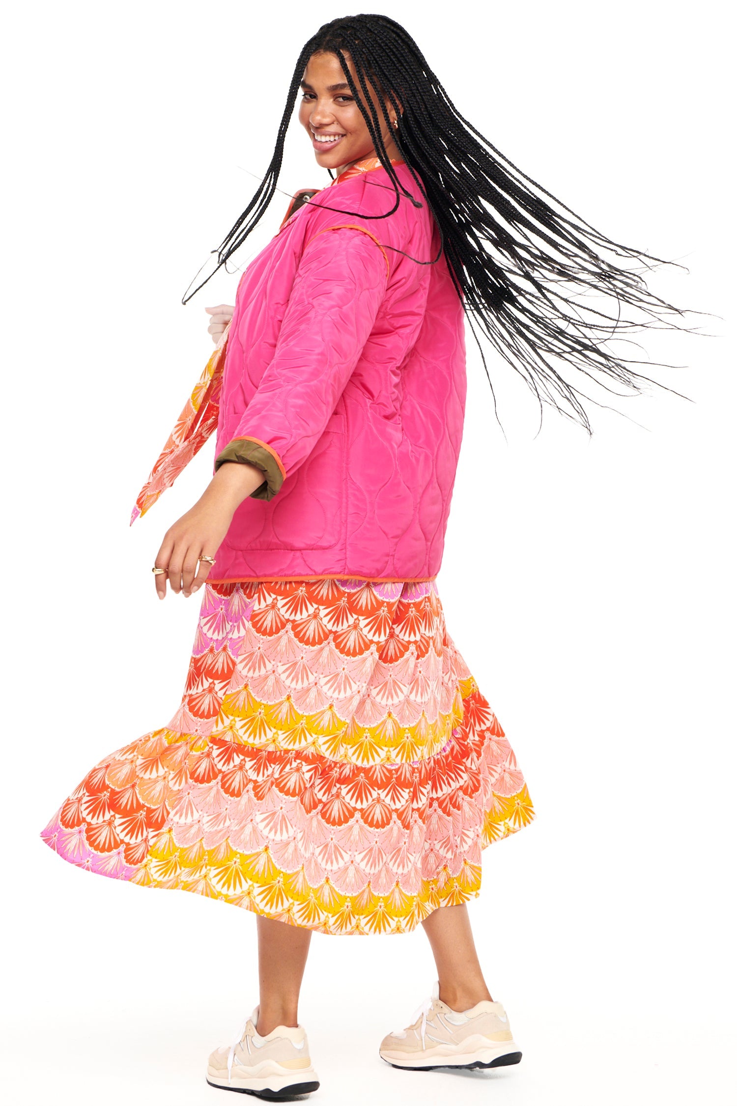Model wearing Pink And Khaki Reversible Quilted Jacket standing facing the camera