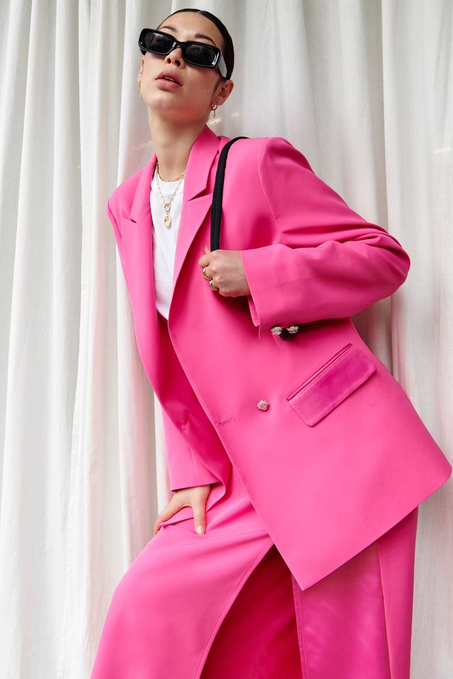 Model wearing Pink 54 Blazer standing facing the camera
