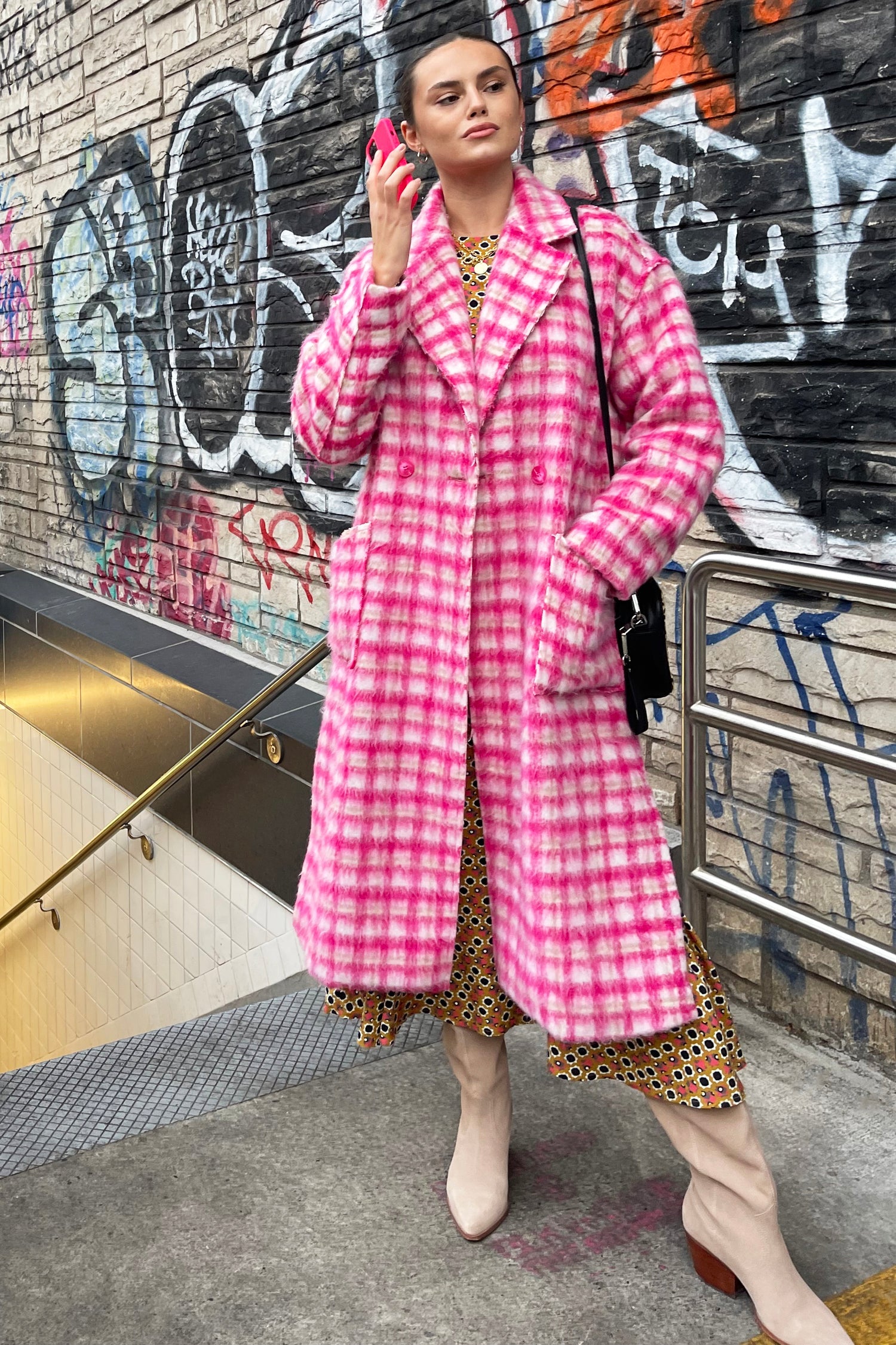 Model wearing Pink Check Zadie Coat standing facing the camera
