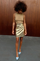 Thumbnail for Model wearing Gold Vegan Leather Mini Wrap skirt