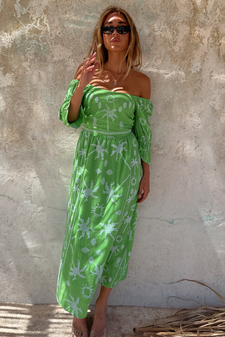 caption_Model wears Green Palm Cross Stitch Belle Dress in UK size 10/ US 6