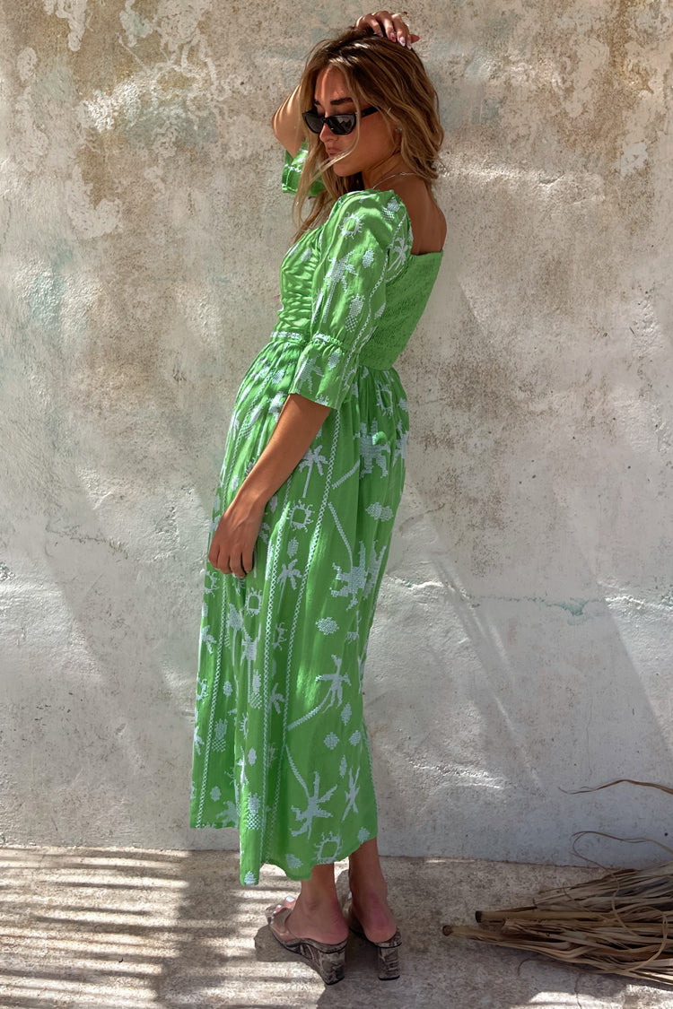 caption_Model wears Green Palm Cross Stitch Belle Dress in UK size 10/ US 6