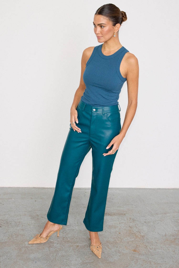 caption_Model wears Teal Vegan Leather Trousers  in UK size 10/ US 6