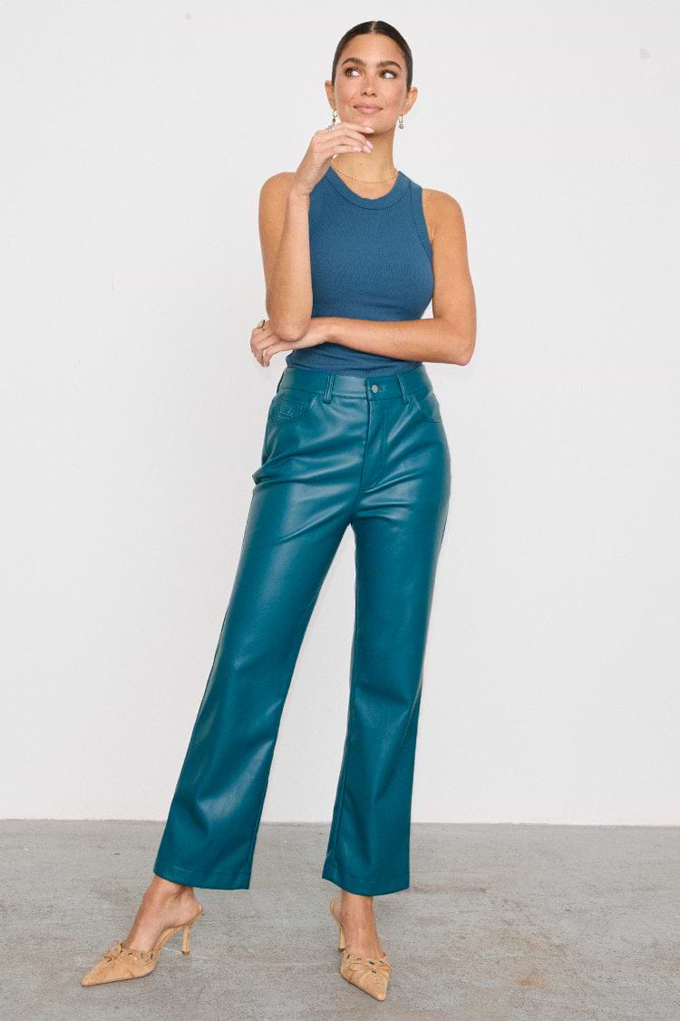 caption_Model wears Teal Vegan Leather Trousers  in UK size 10/ US 6