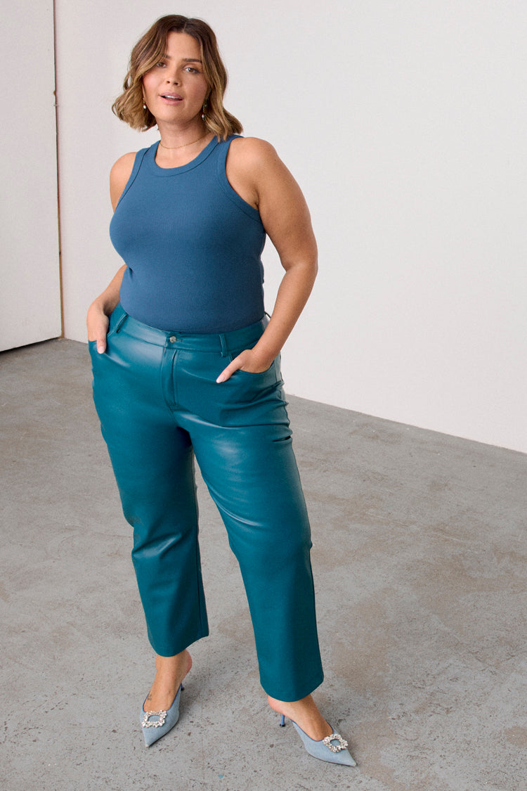 caption_Model wears Teal Vegan Leather Trousers  in UK size 18/ US 14